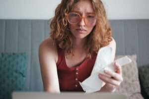 Trumpova administrácia začala strhávať mzdy dlžníkom so študentskými pôžičkami v...