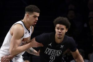 NBA známky za výmenu Michaela Portera Jr. za Cama Johnsona pre Nuggets a Nets.